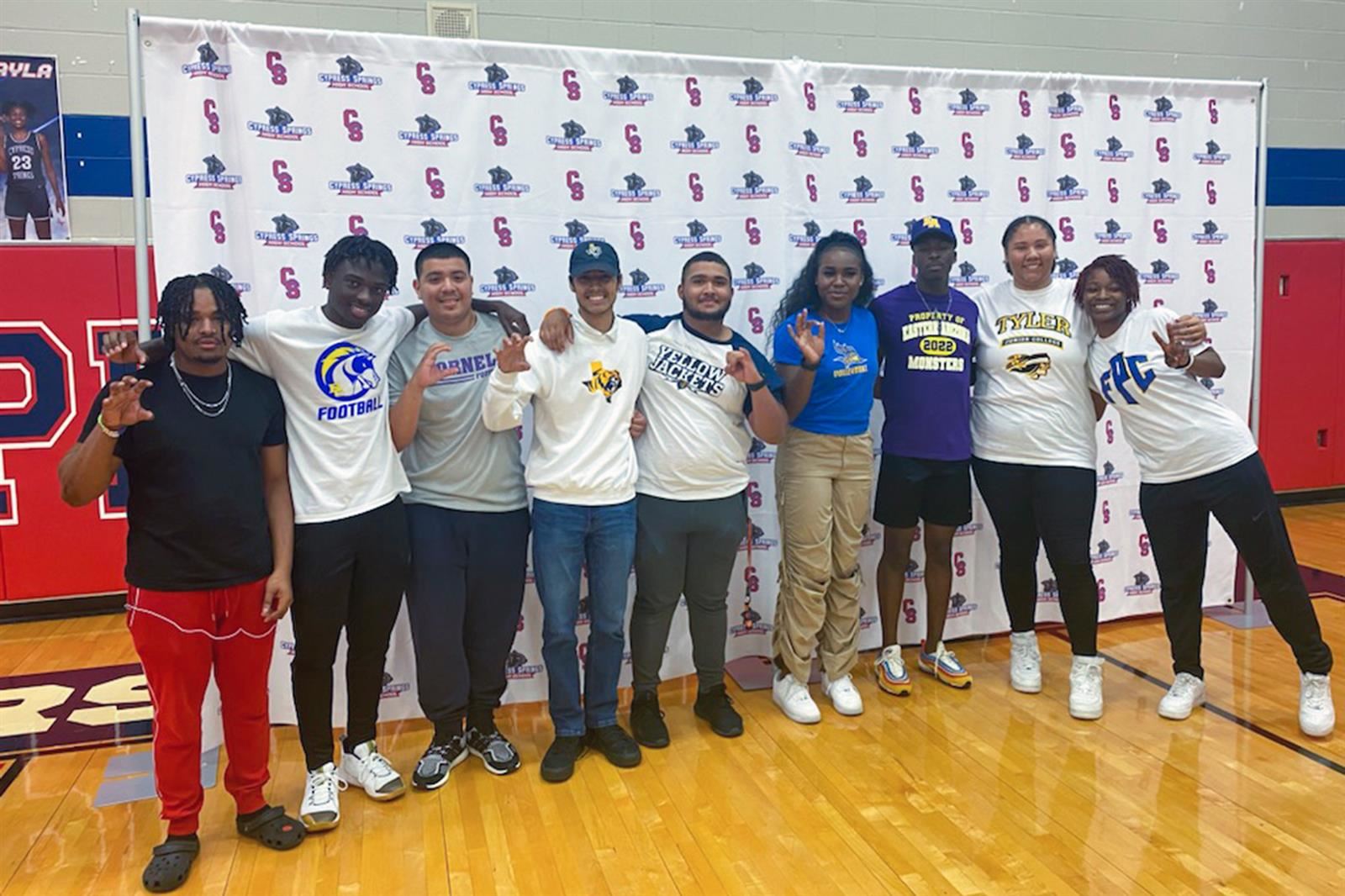  More than 60 CFISD athletes sign during the spring signing day.